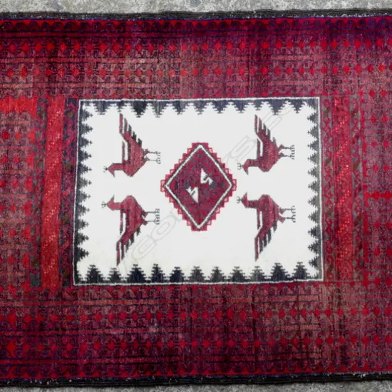An Iranian Baluchi all wool rug