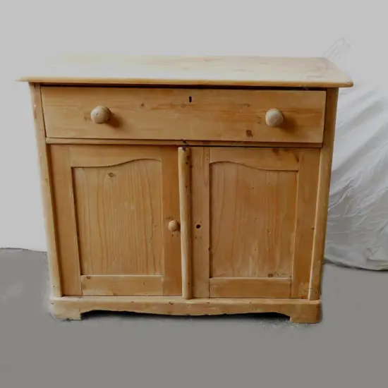 A Victorian pine cabinet of plain country style