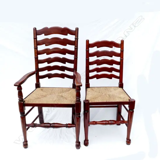 A set of ten walnut Lancashire ladderback country dining chairs (eight singles and two carvers)