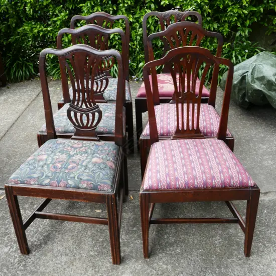 A harlequin set of six Georgian mahogany Hepplewhite and Chippendale dining chairs