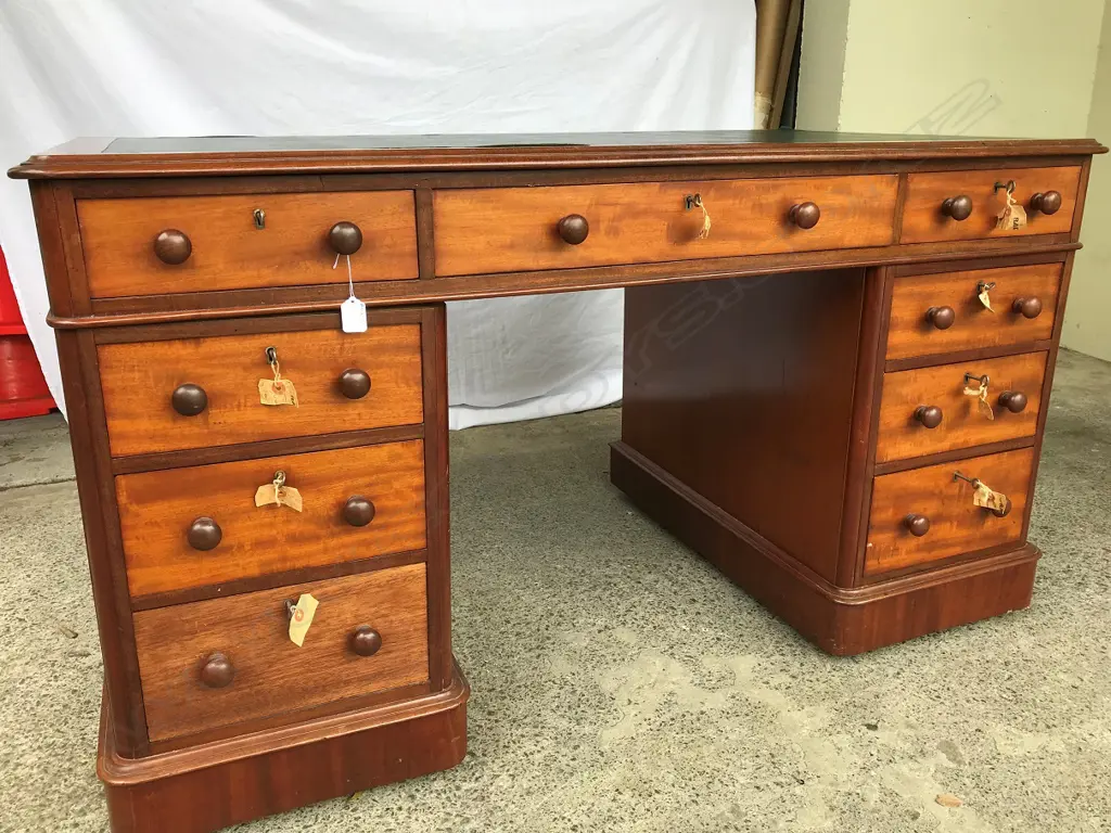 A Victorian mahogany pedestal knee hole desk Image 1++