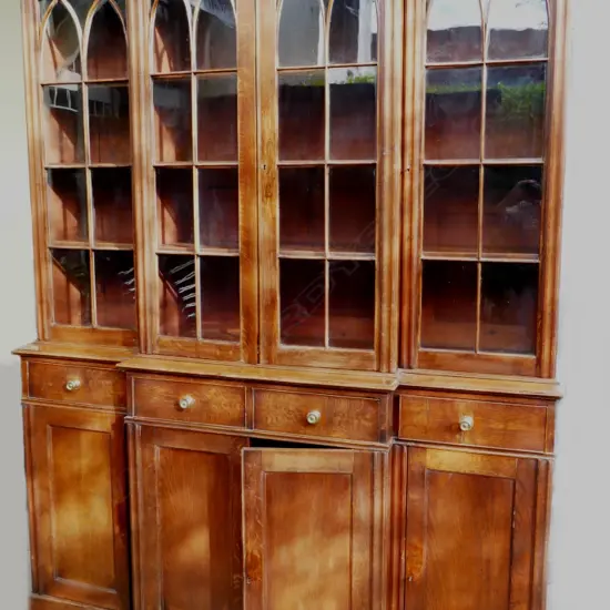 A good quality English oak breakfront bookcase cabinet of Georgian country style