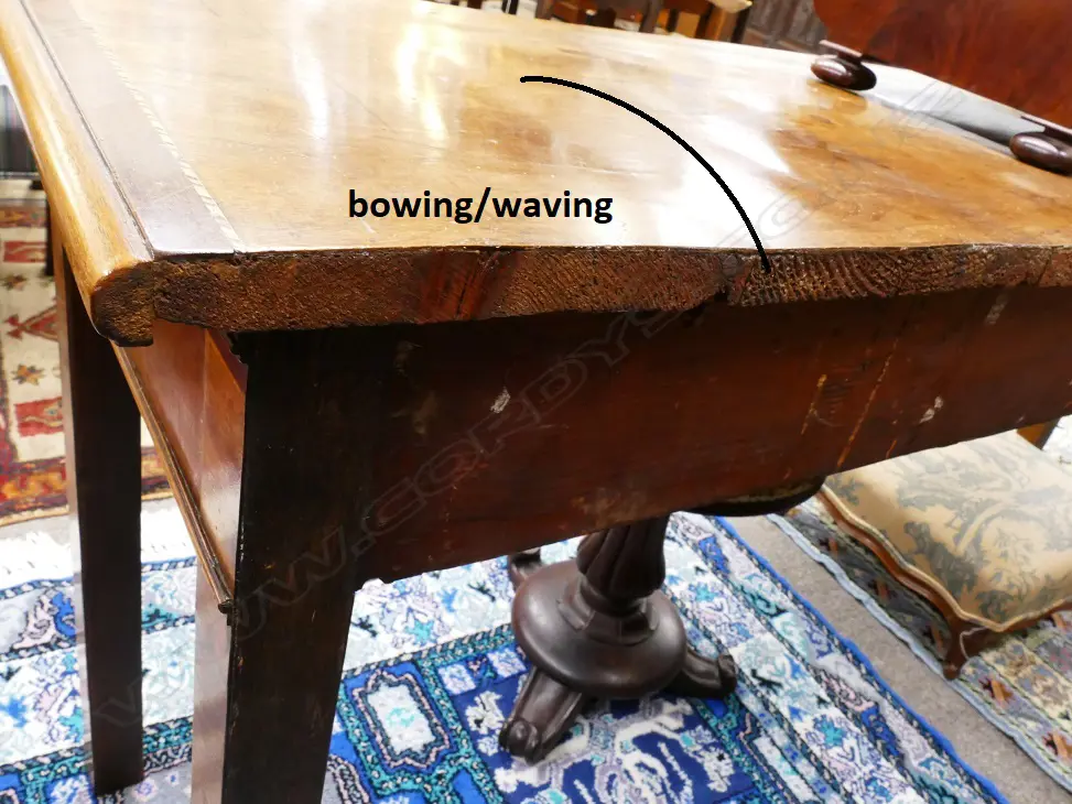A Georgian walnut serpentine side table with cross banding and herringbone stringing Image 1++