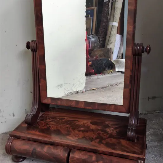 An early Victorian mahogany cheval toilet mirror