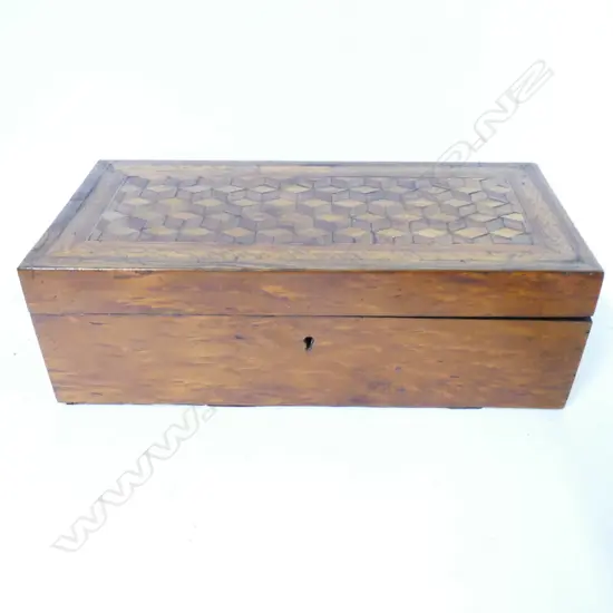 A Victorian inlaid wood dressing table box with red lined interior