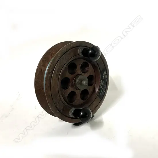 A c.1940s good English 7" oak wood sea reel