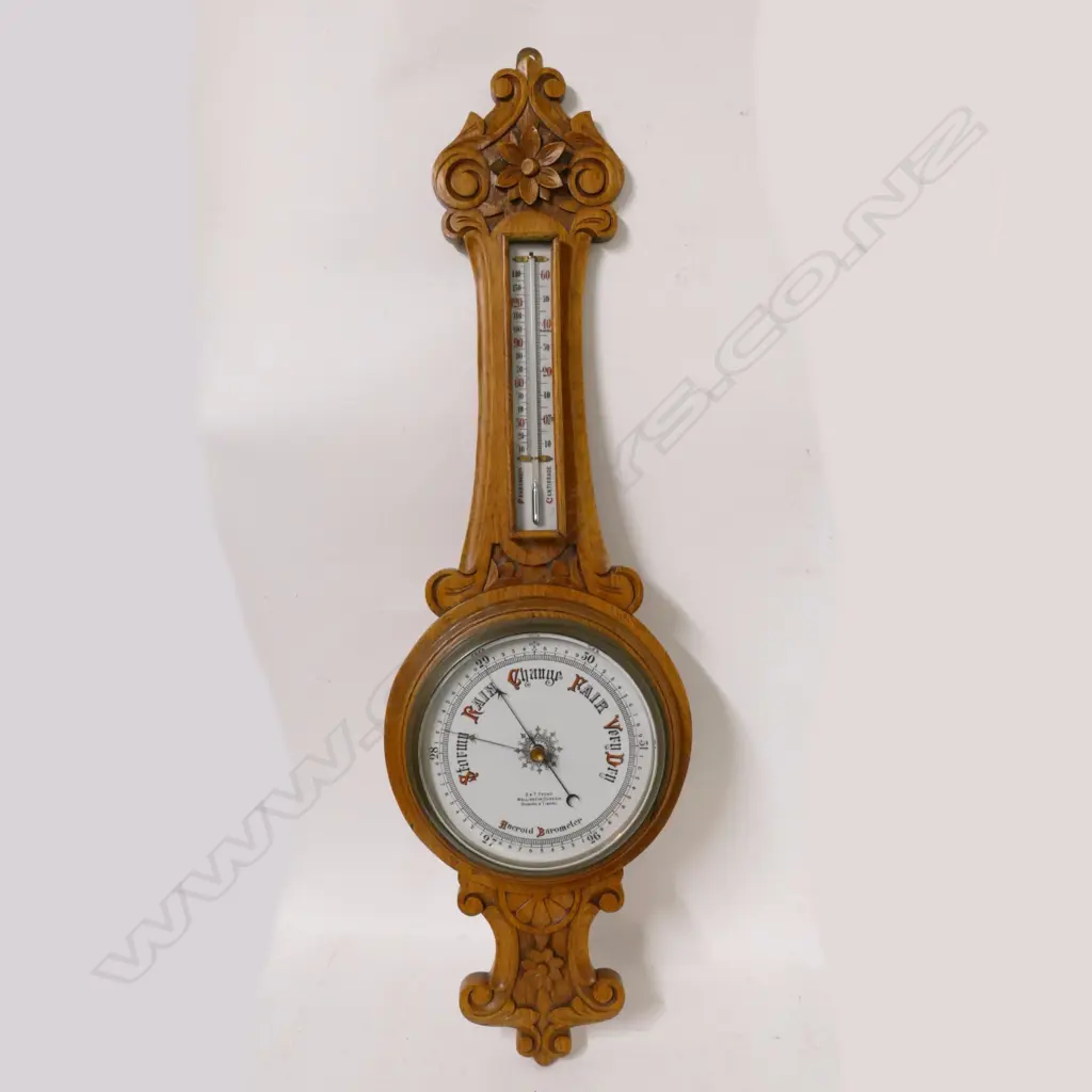 An Edwardian carved oak banjo wall aneroid barometer Image 1++