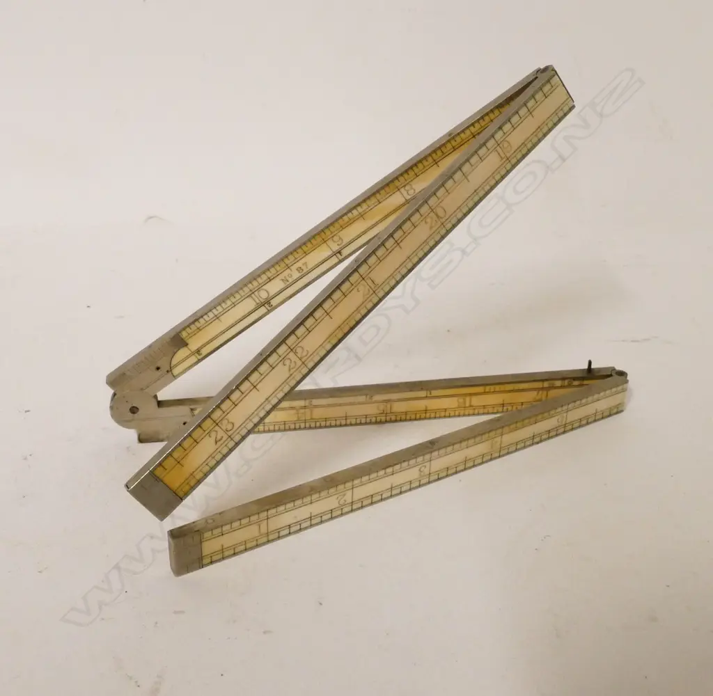 A Stanley No. 87 four-fold ivory 24" rule Image 1++