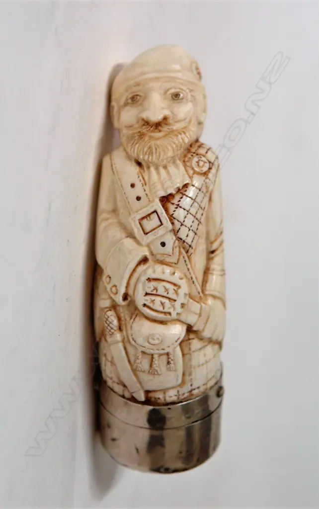 A sperm whale tooth carved snuff mull as a Scottish gent with silver fitting Image 1++