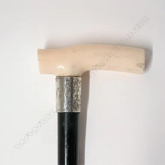 An Edwardian ivory handled and ebony walking stick