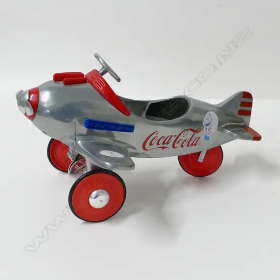 A large boxed Coca-Cola model pedal plane