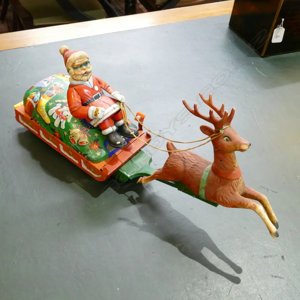 A vintage Japanese tin plate Santa on Sleigh battery toy Image 1++