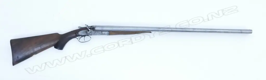 A 12g double barrel shotgun Image 1++