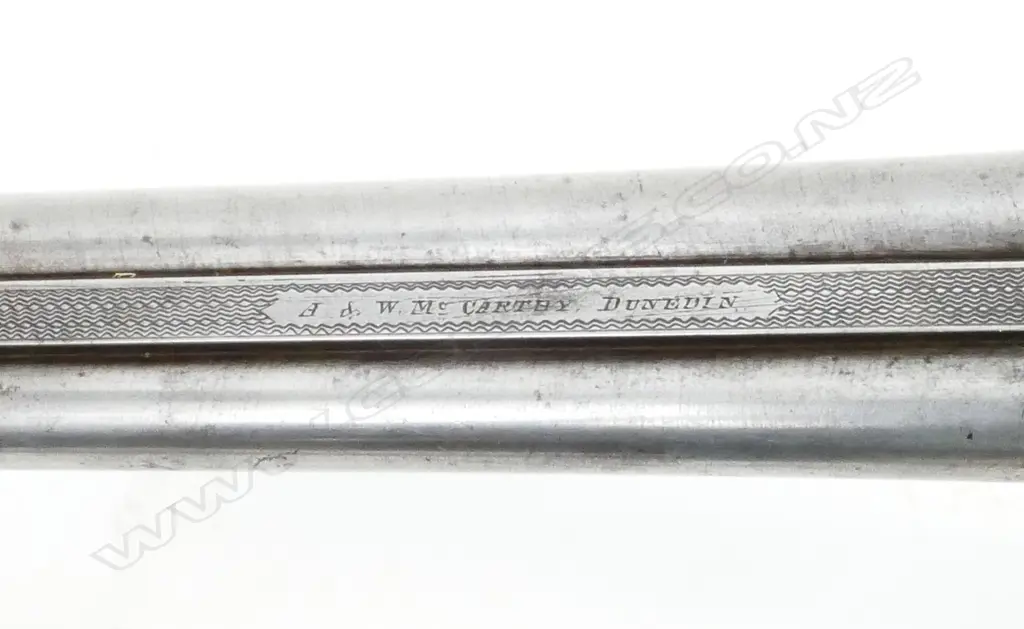 A 12g double barrel shotgun Image 1++