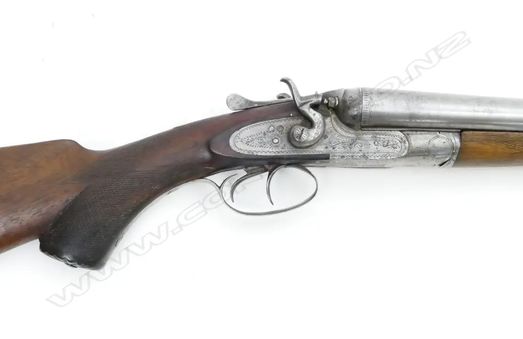 A 12g double barrel shotgun Image 1++