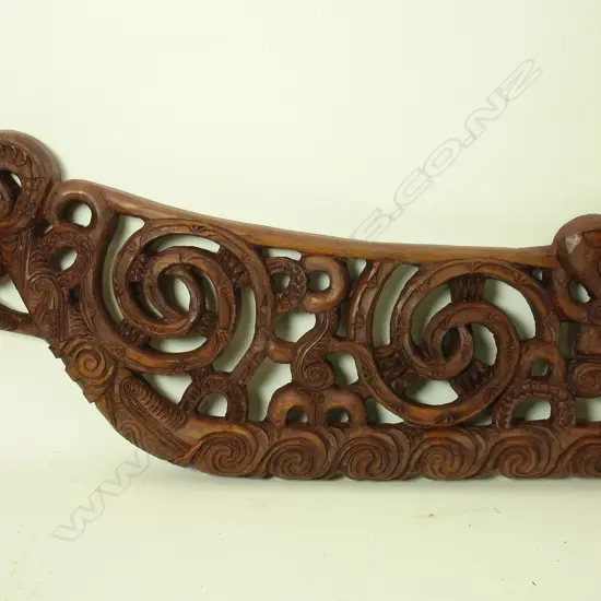 A Maori carved stylised canoe prow