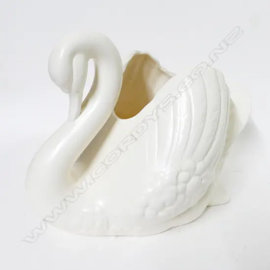 A large white Crown Lynn swan