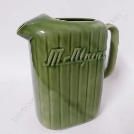 A vintage Crown Lynn yellow glazed McAlpine refrigerator jug