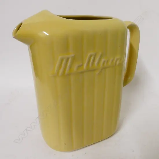 A vintage Crown Lynn yellow glazed McAlpine refrigerator jug