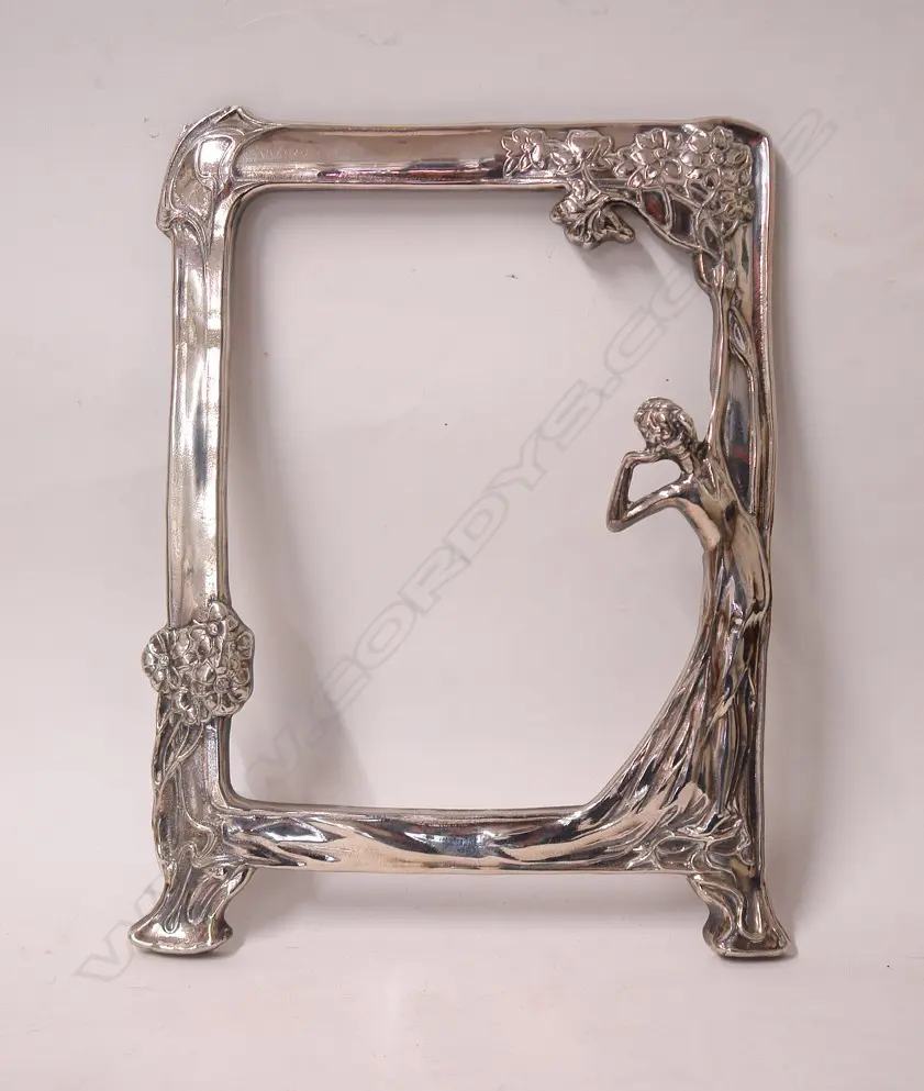 An Art Nouveau style silver plate mirror frame Image 1++