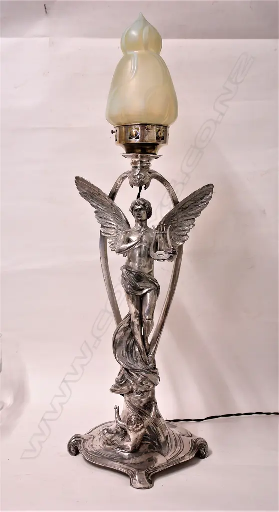 A large WMF Art Nouveau silver plate lamp with a winged figure Image 1++