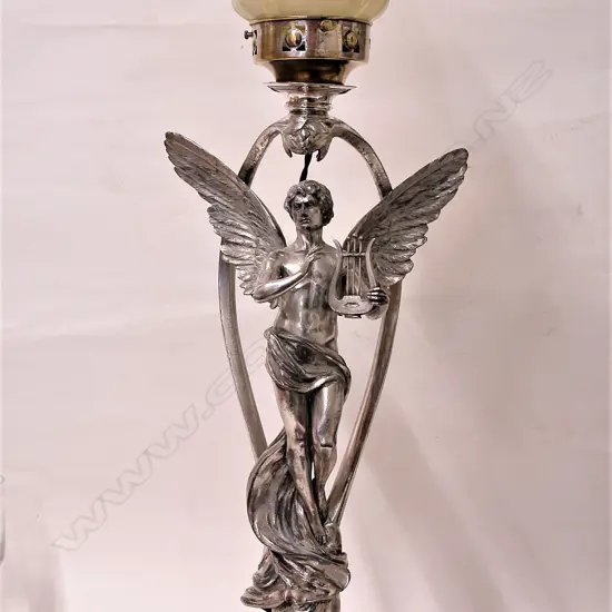 A large WMF Art Nouveau silver plate lamp with a winged figure