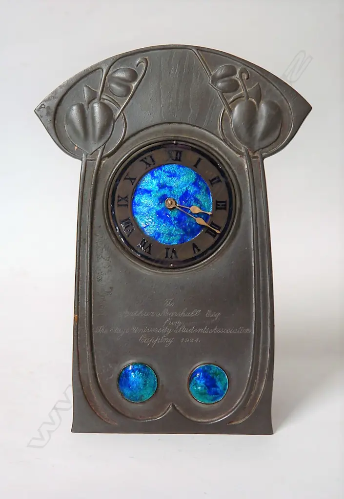 A Tudric pewter and enamel clock designed by Archibald Knox (British 1864-1933) Image 1++