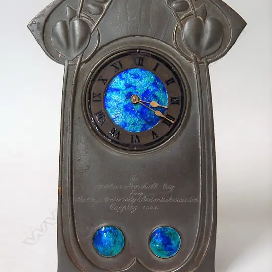 A Tudric pewter and enamel clock designed by Archibald Knox (British 1864-1933)