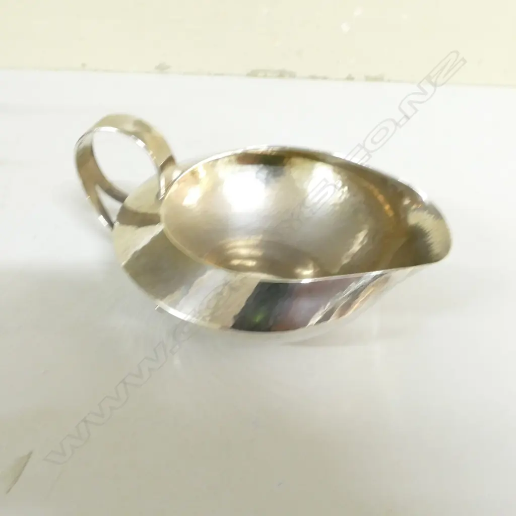 A rare Liberty & Co. Cymric silver four-piece tea service Image 1++