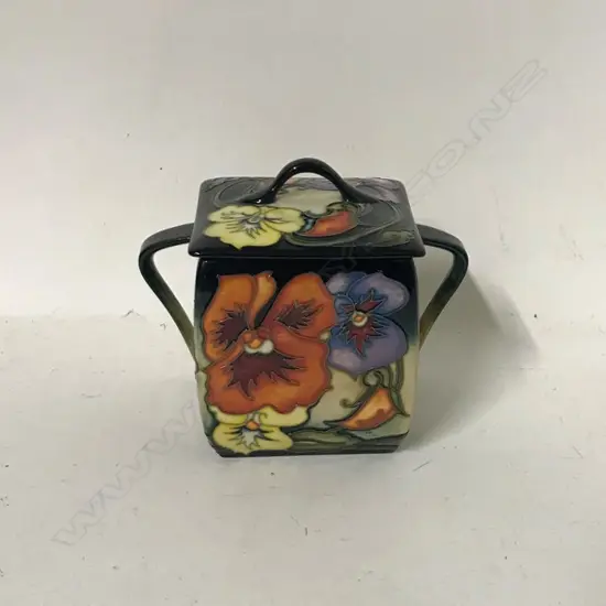 A Moorcroft tangerine candy biscuit barrel