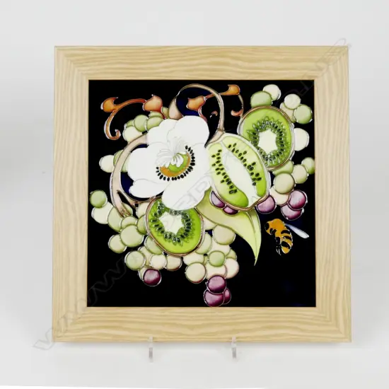 A framed Moorcroft plaque