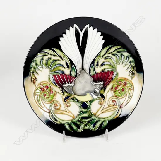 A Moorcroft plate decorated with a fantail