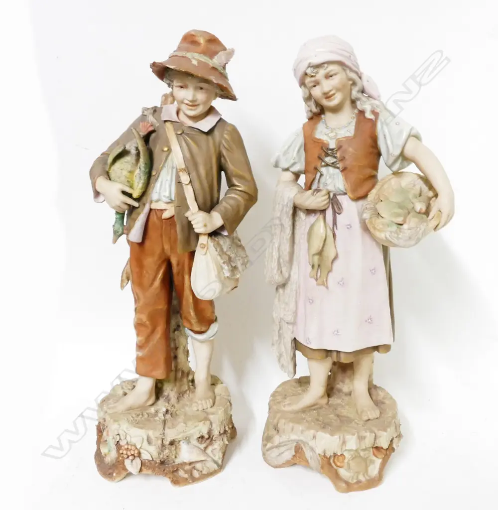 A pair of Royal Dux figures of a young huntsman and his fisherwoman companion Image 1++