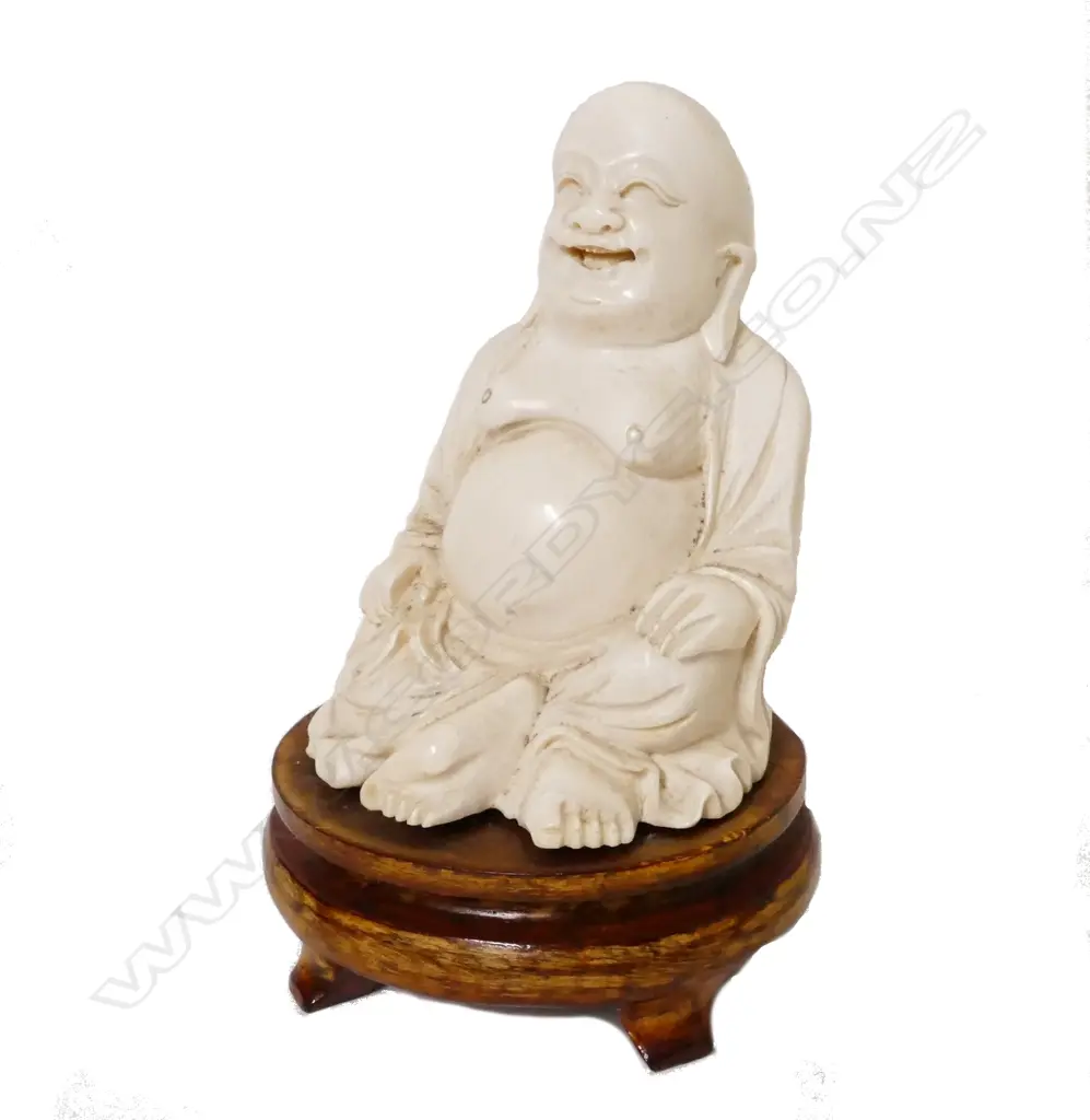 A solid Chinese ivory figure of the seated Hotei Image 1++