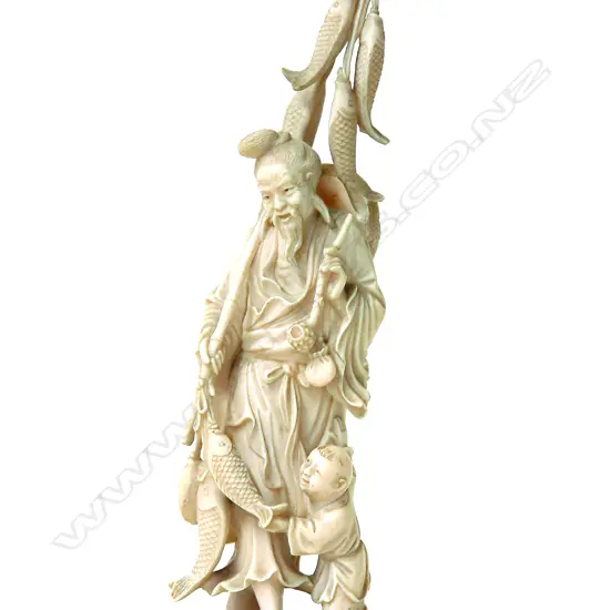 An old Chinese carved ivory figure of a fisherman
