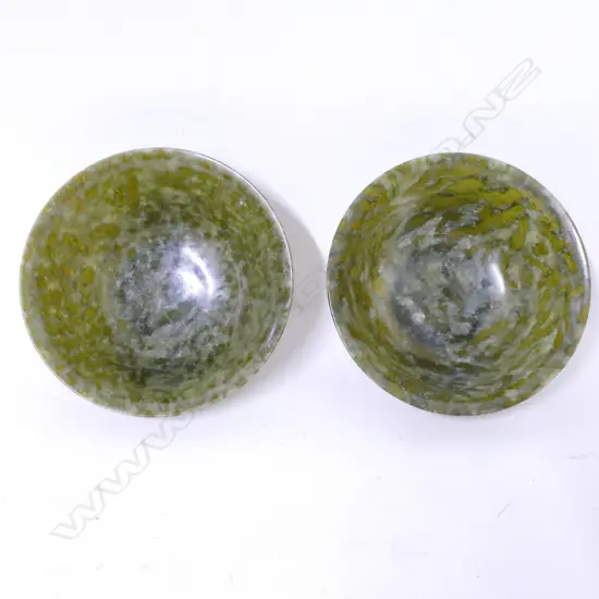 A pair of Chinese spinach green jade bowls