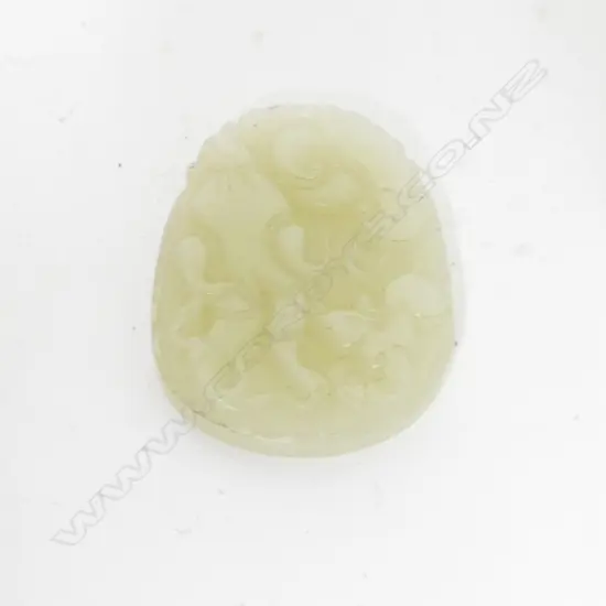 A carved Chinese jade pendant carving