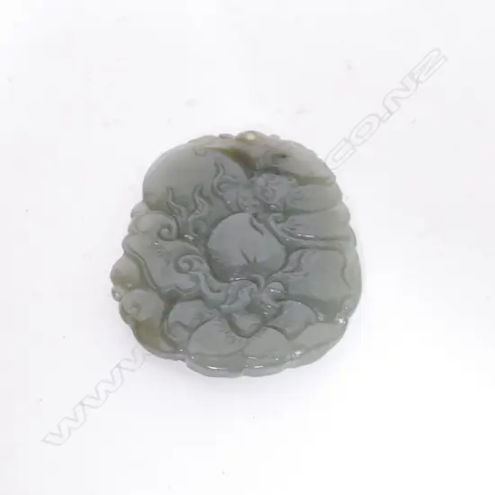 A carved Chinese jade pendant