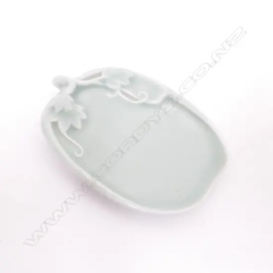 A small Chinese celadon glazed leaf shaped dish