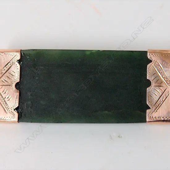 A 9ct. rose gold capped greenstone wide bar brooch