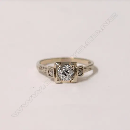 A lady's estate 18ct. white gold and diamond solitaire ring