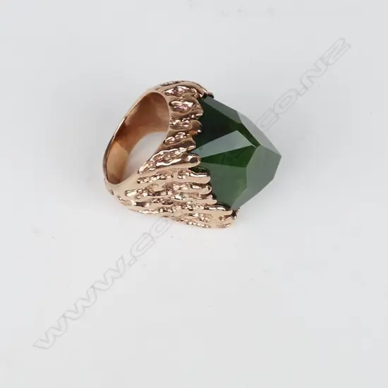 A large and impressive 9ct. rose gold and pounamu gent's ring
