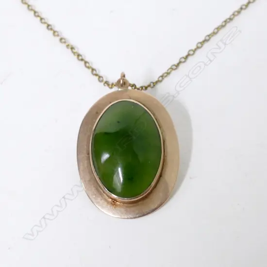 An estate 9ct. yellow gold and greenstone pendant