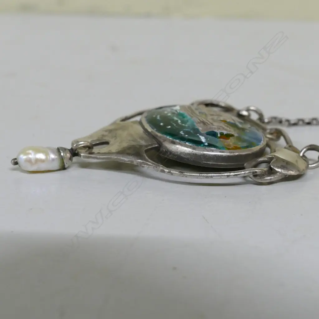 A Reuben Watts silver and enamel pendant Image 1++