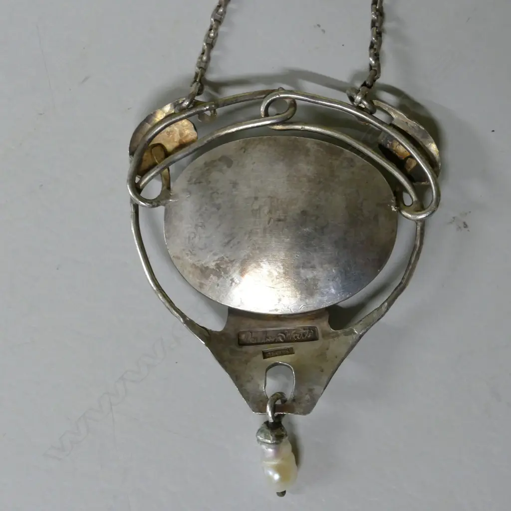 A Reuben Watts silver and enamel pendant Image 1++