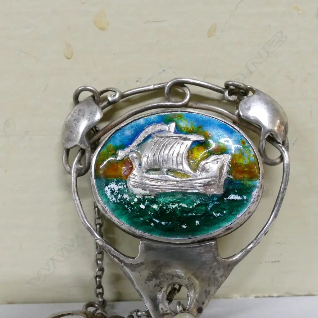 A Reuben Watts silver and enamel pendant Image 1++