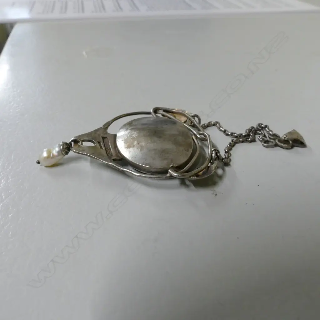 A Reuben Watts silver and enamel pendant Image 1++