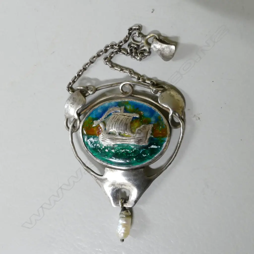 A Reuben Watts silver and enamel pendant Image 1++