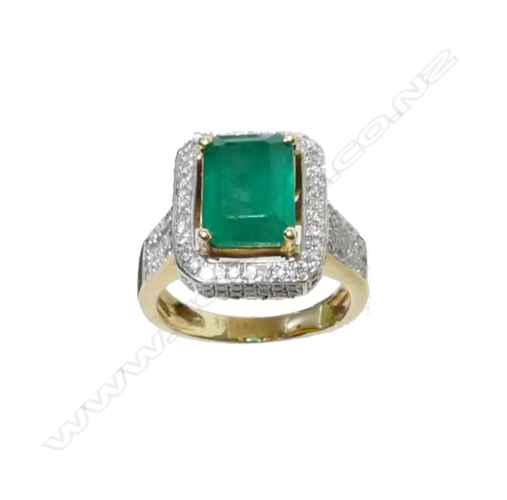 A 14ct. yellow emerald and diamond ring Image 1++