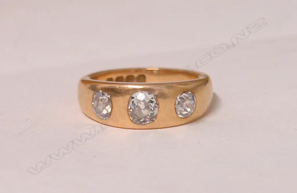 A good 19thC lady's estate 18ct. rose gold and three diamond gypsy style ring Image 1++